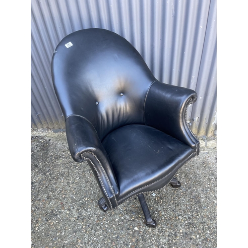 181 - A black leather swivel desk chair