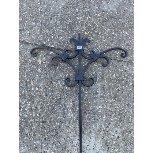 184 - An ornate ironwork garden hanger 220cm