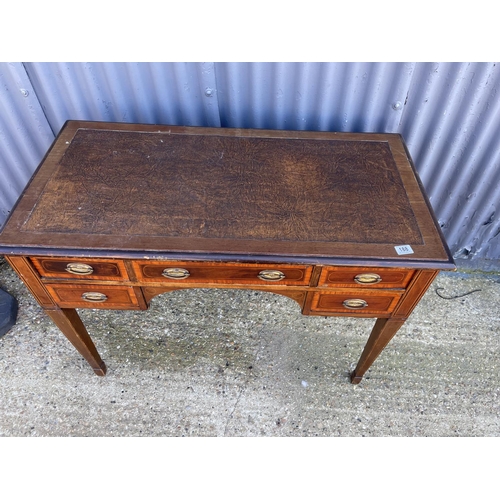 188 - An edwardian mahogany kneehole writing table