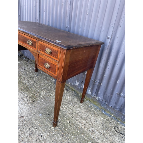 188 - An edwardian mahogany kneehole writing table