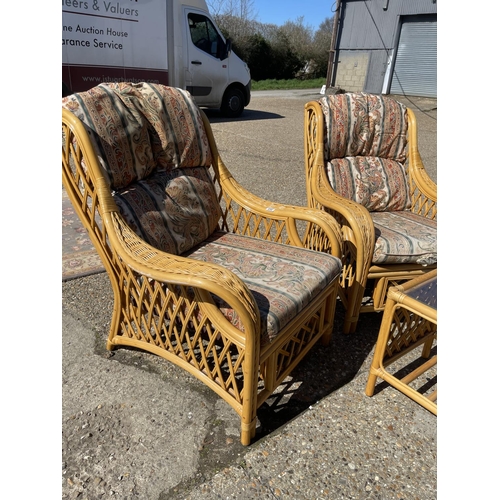 203 - A pair of bamboo conservatoy armchairs with matching occasional table