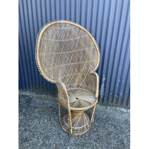 219 - A mid century PEACOCK back rattan chair