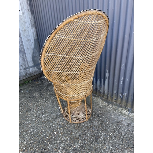 219 - A mid century PEACOCK back rattan chair