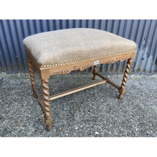 233 - A large barley twist oak framed stool seat with stuffed hessian seat 80x50x75