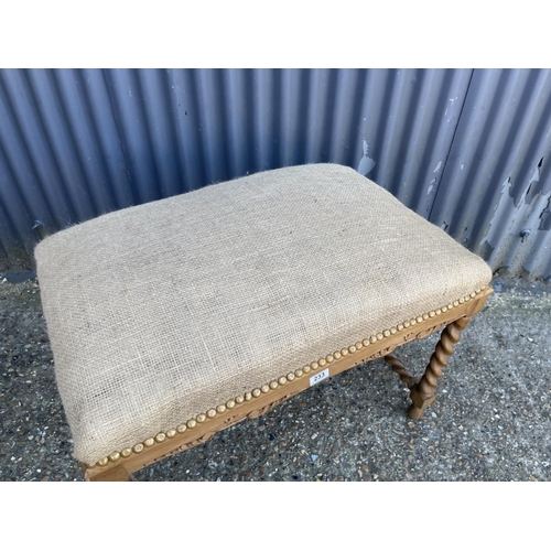 233 - A large barley twist oak framed stool seat with stuffed hessian seat 80x50x75