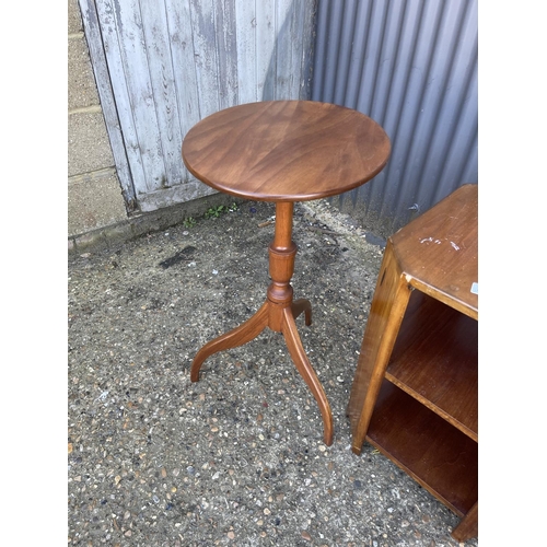 236 - A mahogany snap top tripod table together with a book table and a nest of three