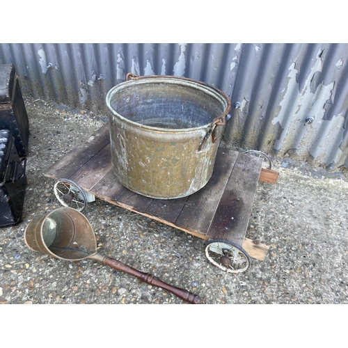 240 - A brass bucket and ladle, trolley, and two vintage boxes