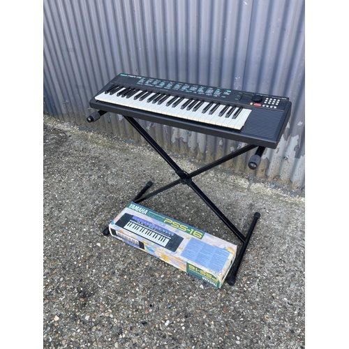 242 - A yamaha keyboard together with a PORTASOUND keyboard