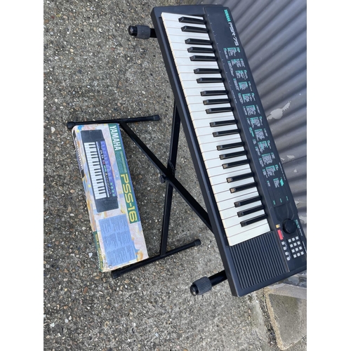 242 - A yamaha keyboard together with a PORTASOUND keyboard