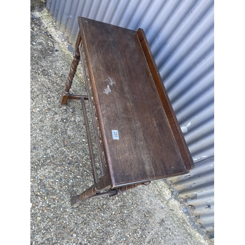 251 - A carved oak hall table with drawer to the end 84x35x77