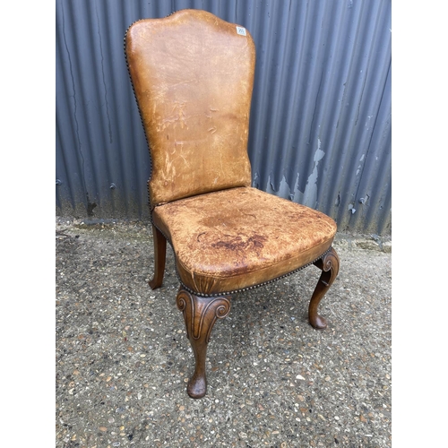 260 - A Queen Anne style tan leather chair