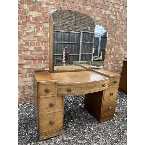 27 - An early 20th century oak dressing table