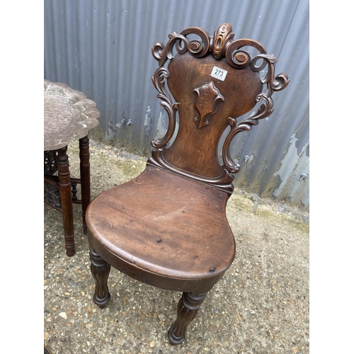 273 - A mahogany hall chair, a brass tray top table, a brass bucket and a brass companion set