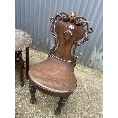 273 - A mahogany hall chair, a brass tray top table, a brass bucket and a brass companion set