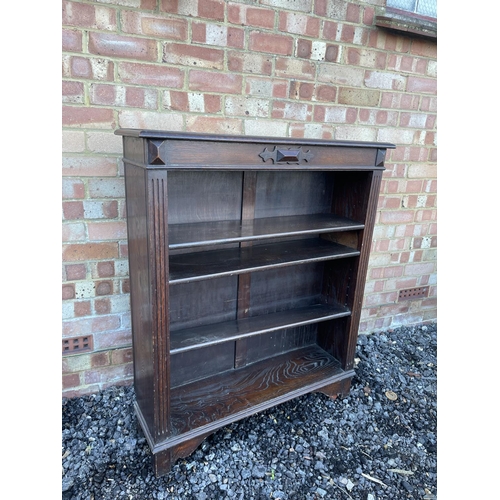 3 - An oak open fronted bookcase with three adjustable shelves 92x27x109