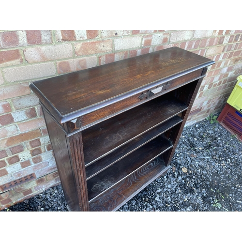 3 - An oak open fronted bookcase with three adjustable shelves 92x27x109