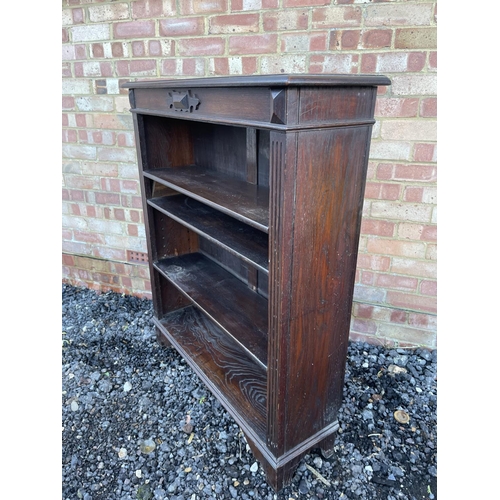 3 - An oak open fronted bookcase with three adjustable shelves 92x27x109