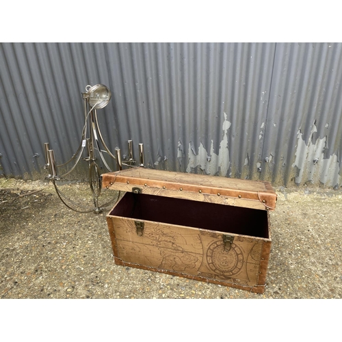 373 - A modern chrome chandelier light fitting together with a modern trunk