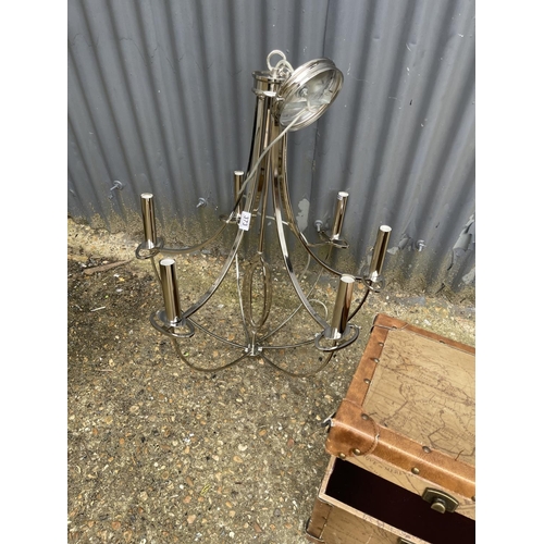 373 - A modern chrome chandelier light fitting together with a modern trunk