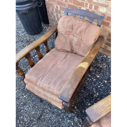 4 - A pair of early 20th century oak framed easy chairs with sliding seat and adjustable backs a/f