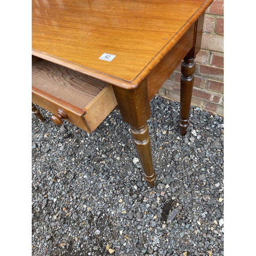 42 - A victorian mahogany two drawer writing table 107 wide