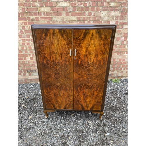 48 - A deco style walnut tallboy cupboard