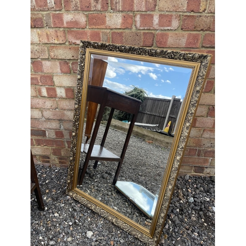 49 - An oak single drawer table, large gilt mirror and deco style frameless mirror