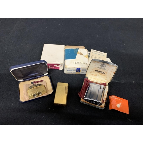 506 - 2 boxed Ronson lighters and Dunhill lighter