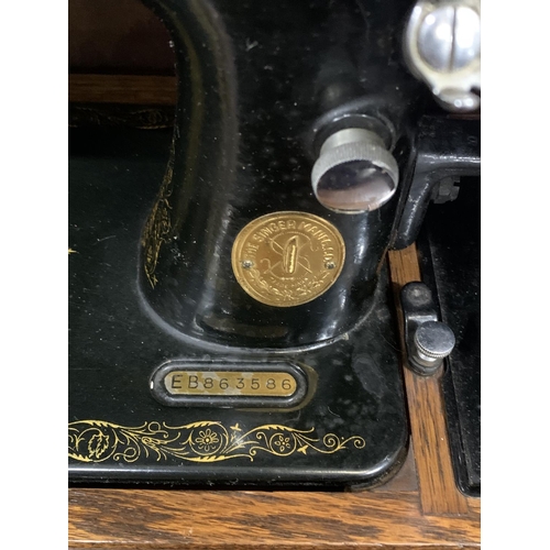 509 - Vintage Singer sewing machine in case with key