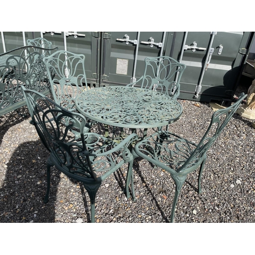 52 - A green painted aluminium garden table together with two chairs and two carver chairs 80cm