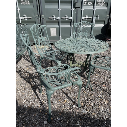 52 - A green painted aluminium garden table together with two chairs and two carver chairs 80cm