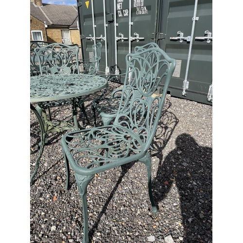 52 - A green painted aluminium garden table together with two chairs and two carver chairs 80cm