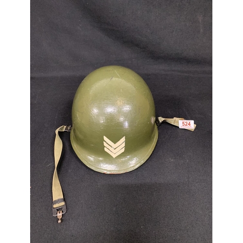 524 - WW2 US Army helmet, repainted having been used by a Re-enactment society