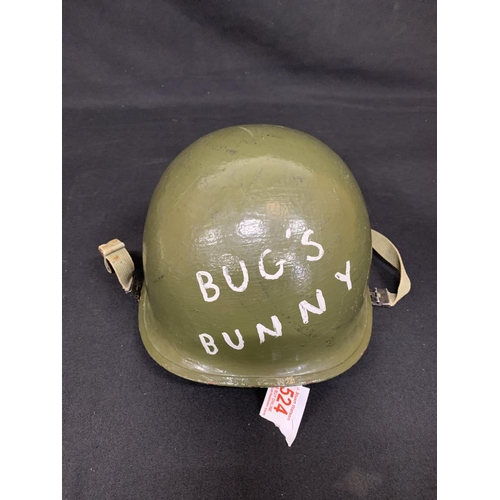 524 - WW2 US Army helmet, repainted having been used by a Re-enactment society