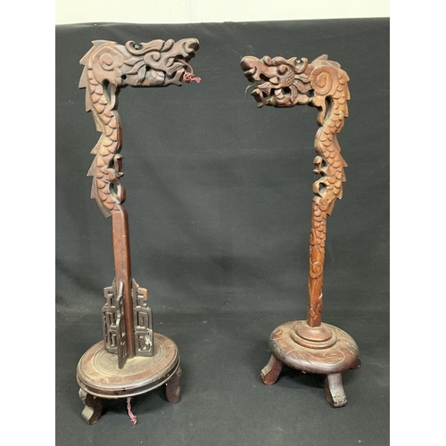 542 - Two carved hardwood dragon lamp standards, height 70cms