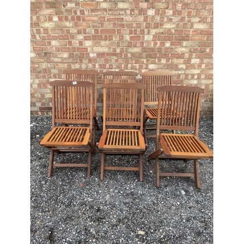 56 - A set of six hardwood folding garden chairs