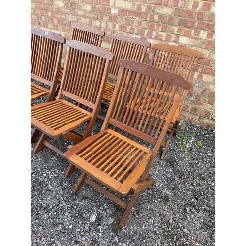 56 - A set of six hardwood folding garden chairs