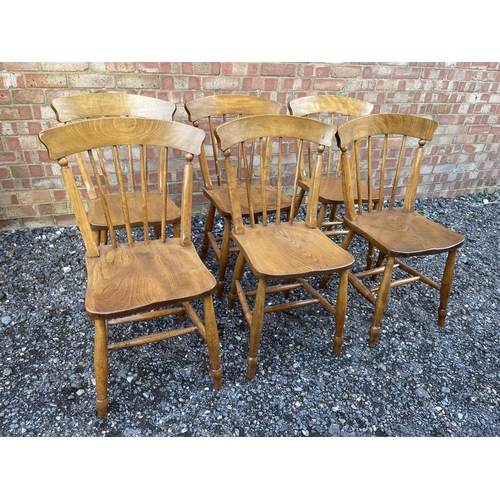 61 - A set of six stick back kitchen chairs