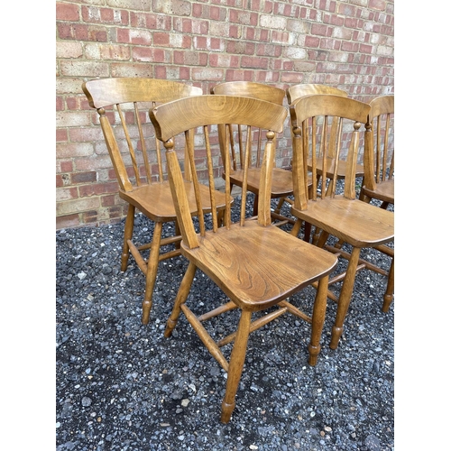 61 - A set of six stick back kitchen chairs