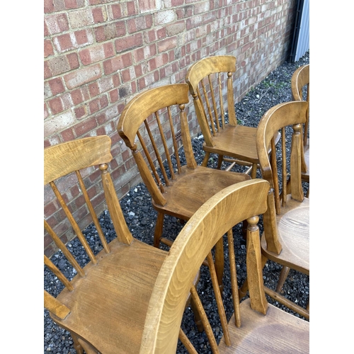 61 - A set of six stick back kitchen chairs