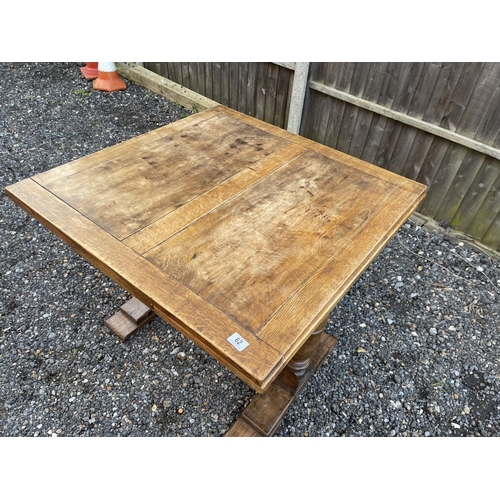 62 - An oak drawer leaf dining table