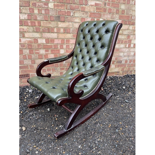 63 - A green leather chesterfield slipper rocking chair