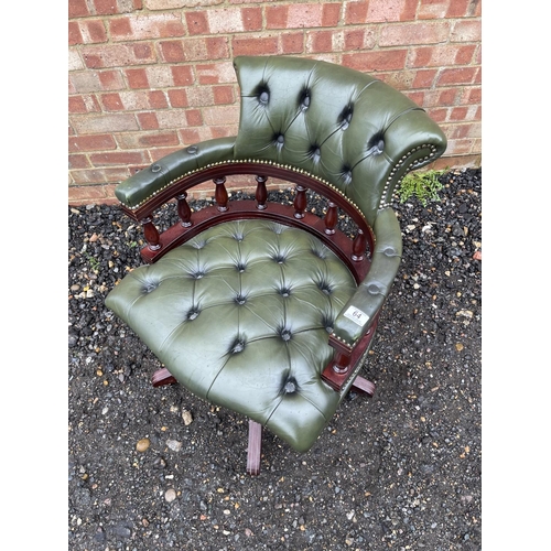 64 - A green leather chesterfield captains swivel desk chair