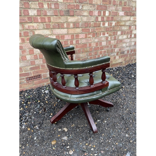 64 - A green leather chesterfield captains swivel desk chair