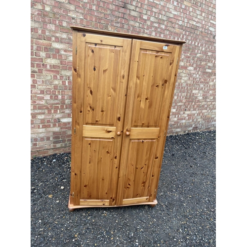 67 - A solid pine double wardrobe 97x 58x158