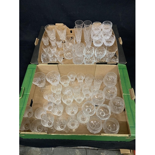 691 - Two trays of stemmed cut drinking glasses including two Edinburgh Crystal tankards (in good conditio... 