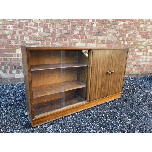 7 - A mid century teak side by side bookcase cupboard 137 x29x30