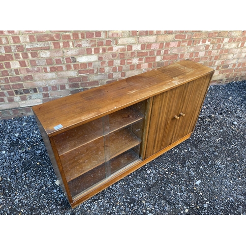 7 - A mid century teak side by side bookcase cupboard 137 x29x30