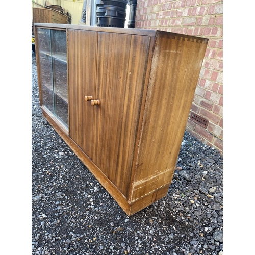 7 - A mid century teak side by side bookcase cupboard 137 x29x30