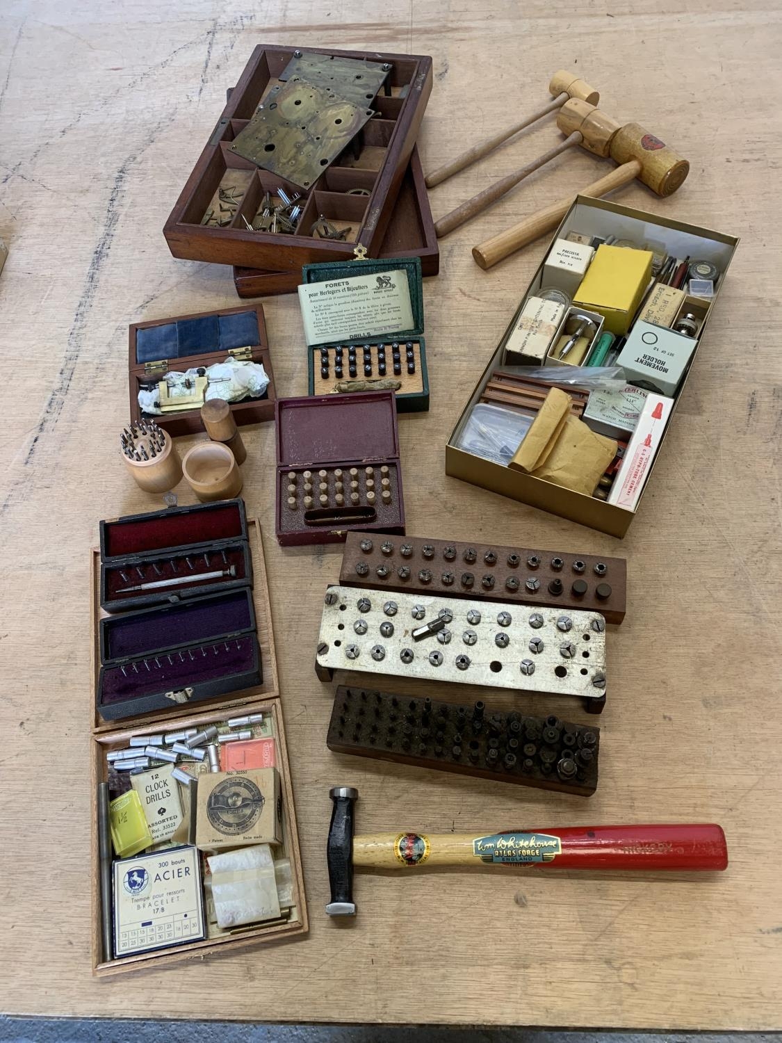 Collection of antique clock and watch parts and tools